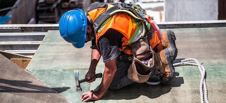 A worker working on a roof