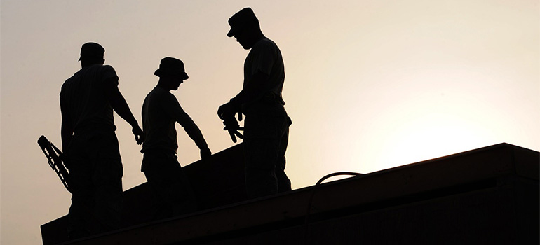 Dallas roof repair team on a roof